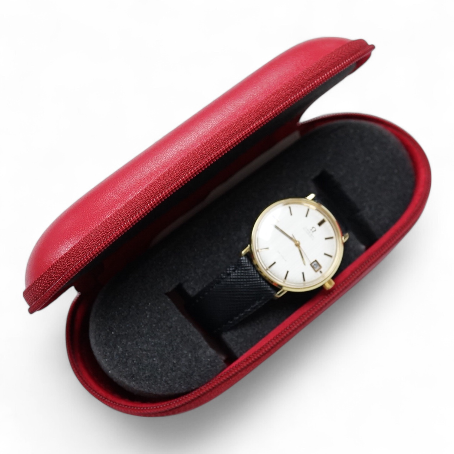 A gentleman's gold plated Omega De Ville automatic wrist watch, with baton numerals and date aperture, case diameter 35mm, on an associated strap, with Omega case.